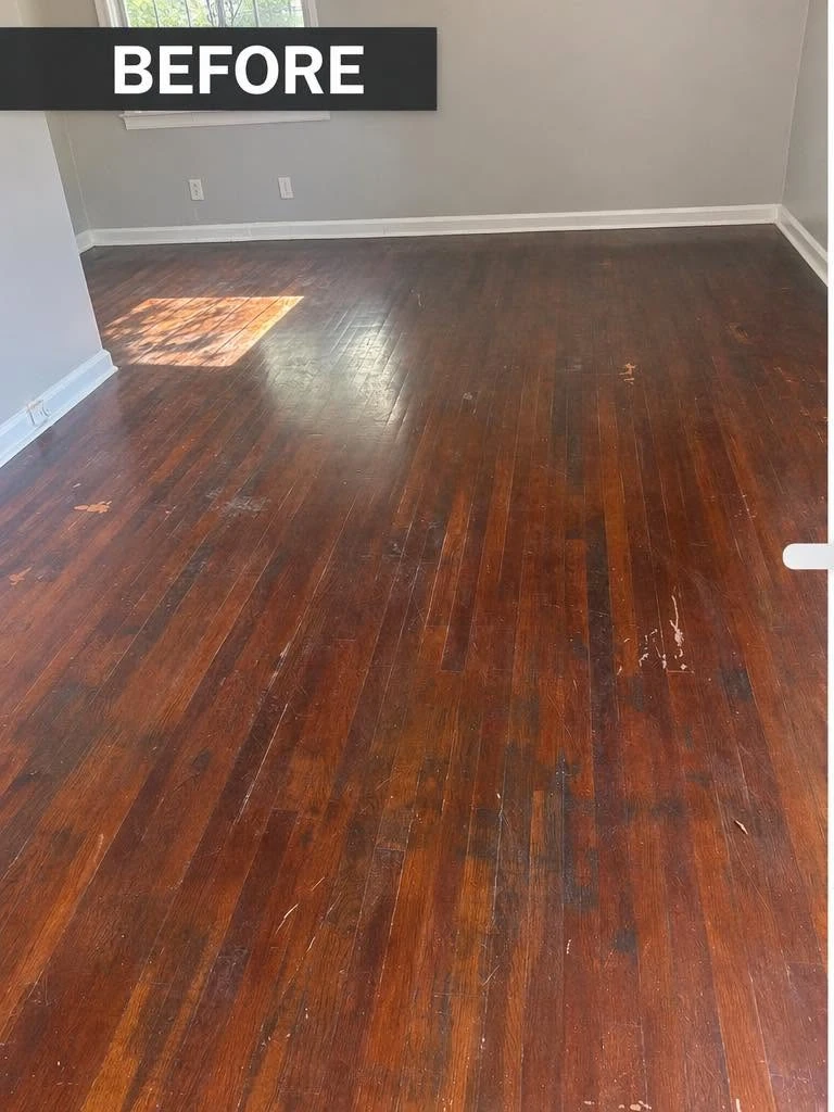 Worn, dull hardwood living room floor before restoration